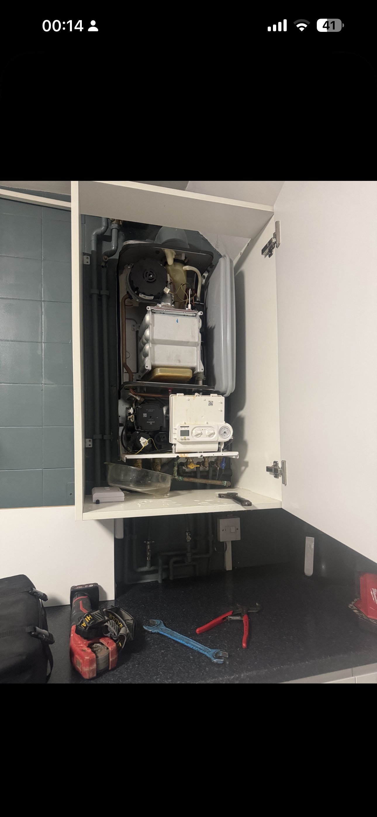 Combi boiler installation with condensate and gas connections