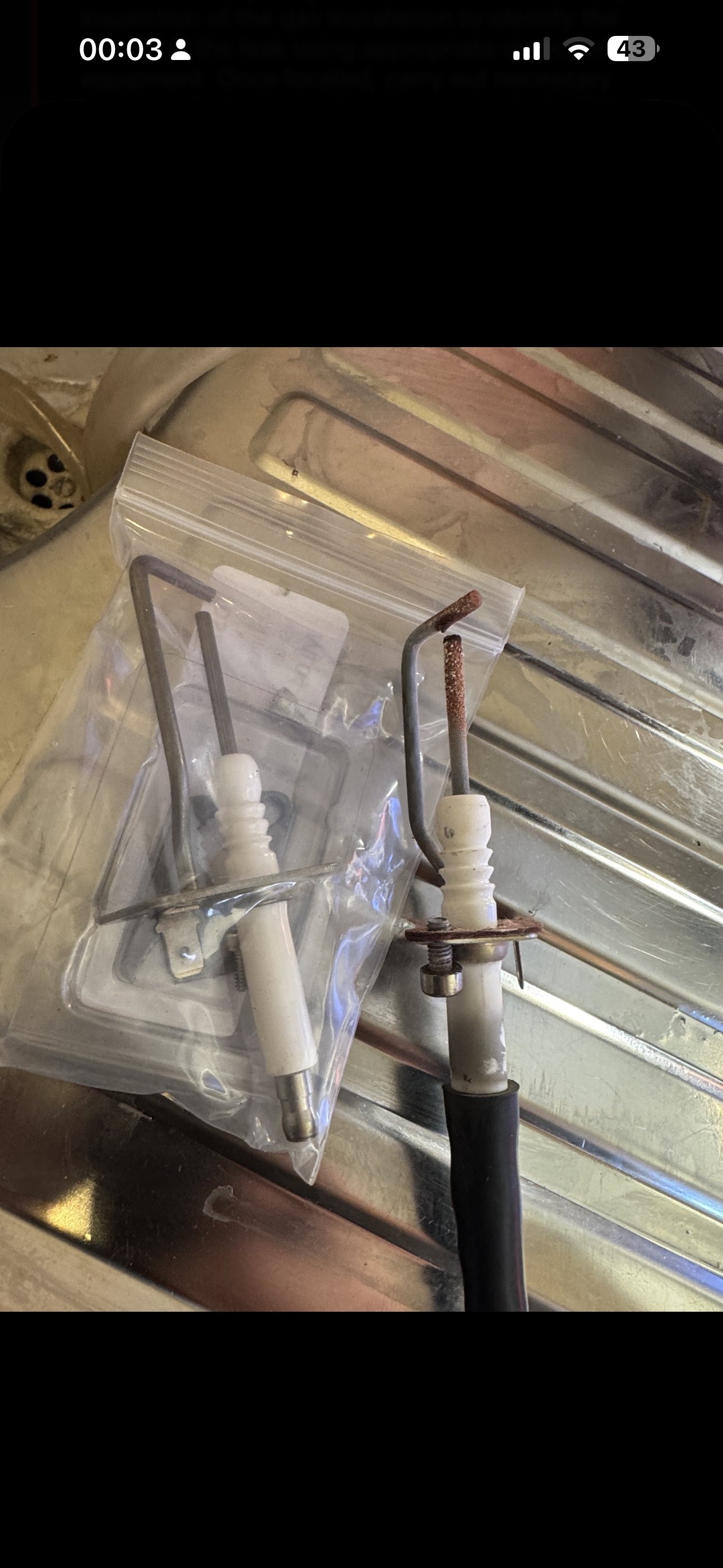 Replacement boiler component being fitted during a repair