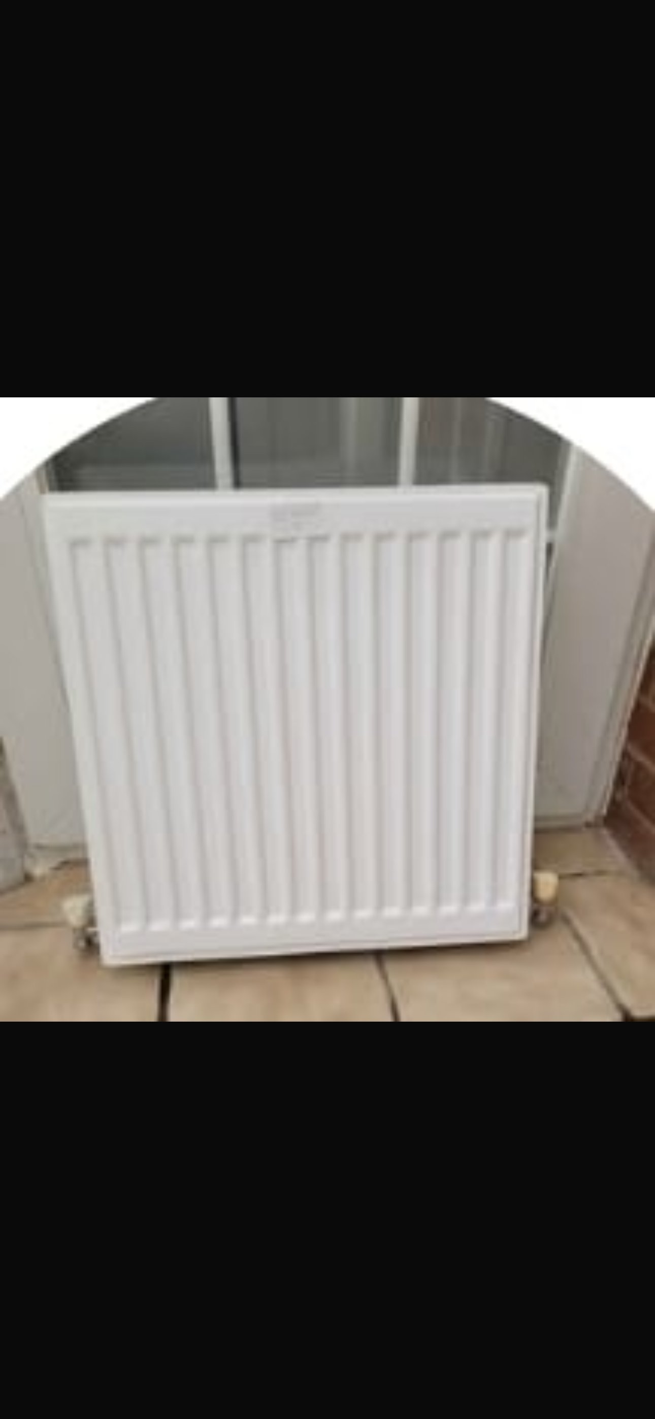 Panel radiator installation with neat pipework