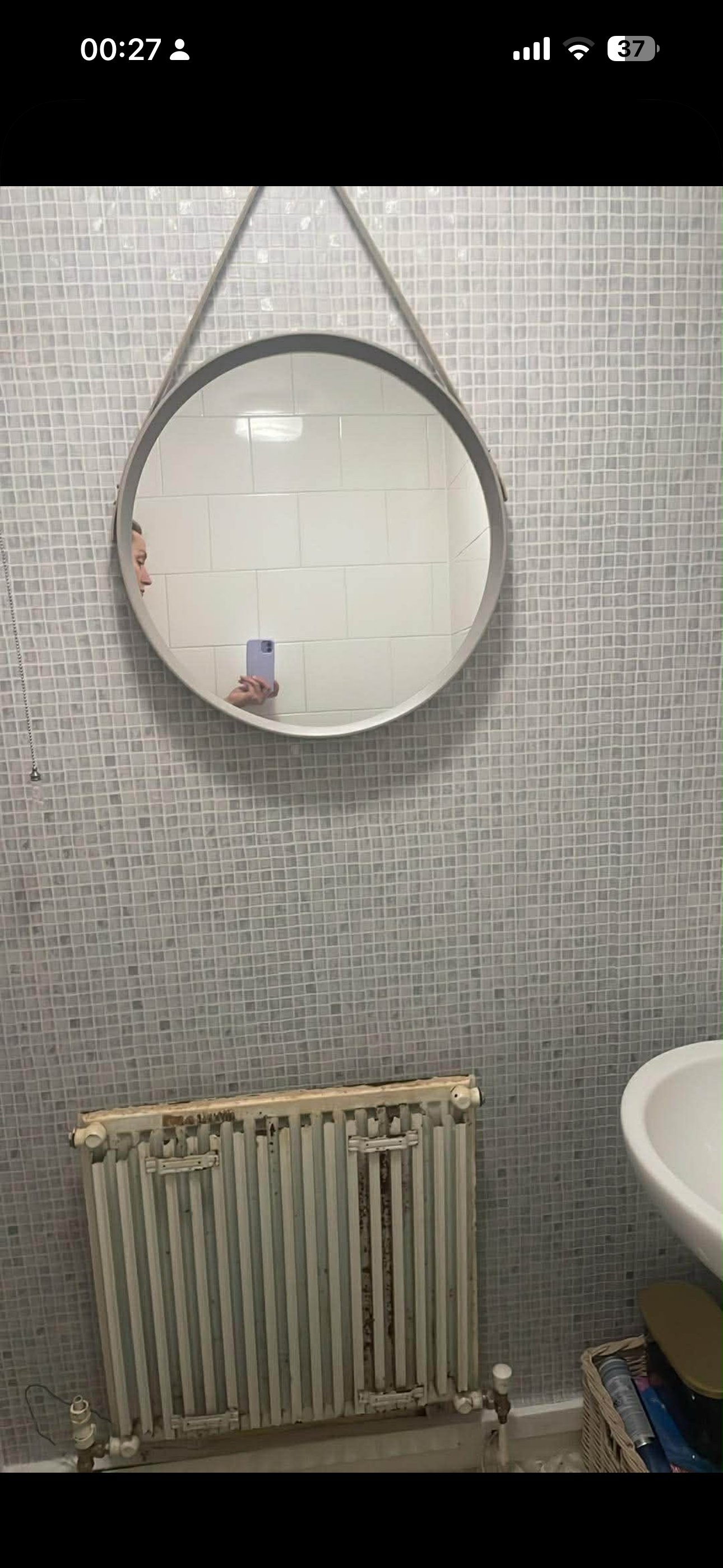 Column designer radiator in a hallway